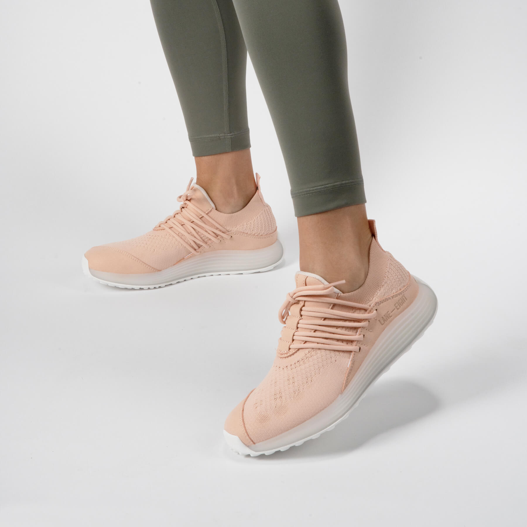 LANEEIGHT-TRAINER-AD-1-PinkSand-WomensOnFoot