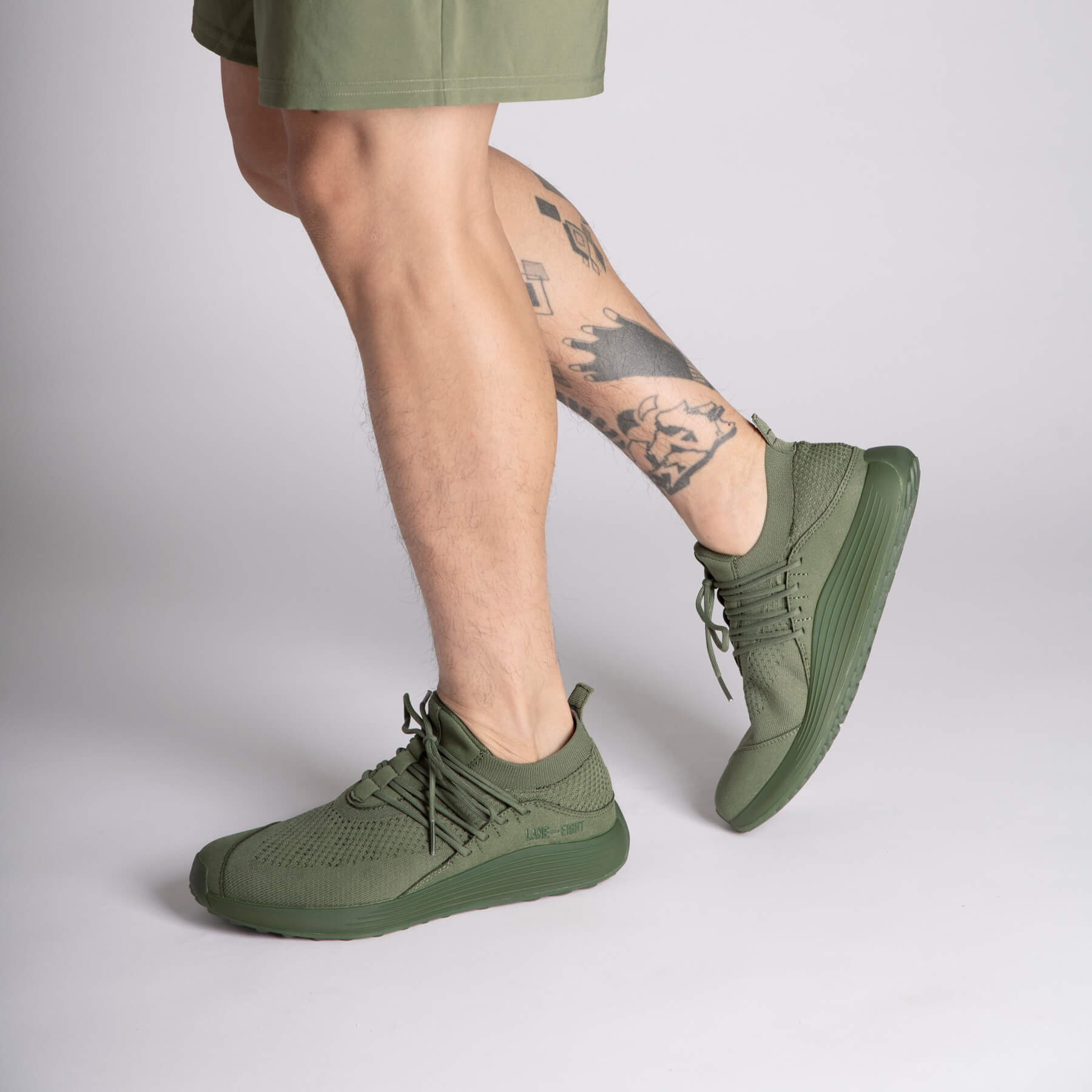 LANEEIGHT-TRAINER-AD-1-EarthGreen-MensOnFoot