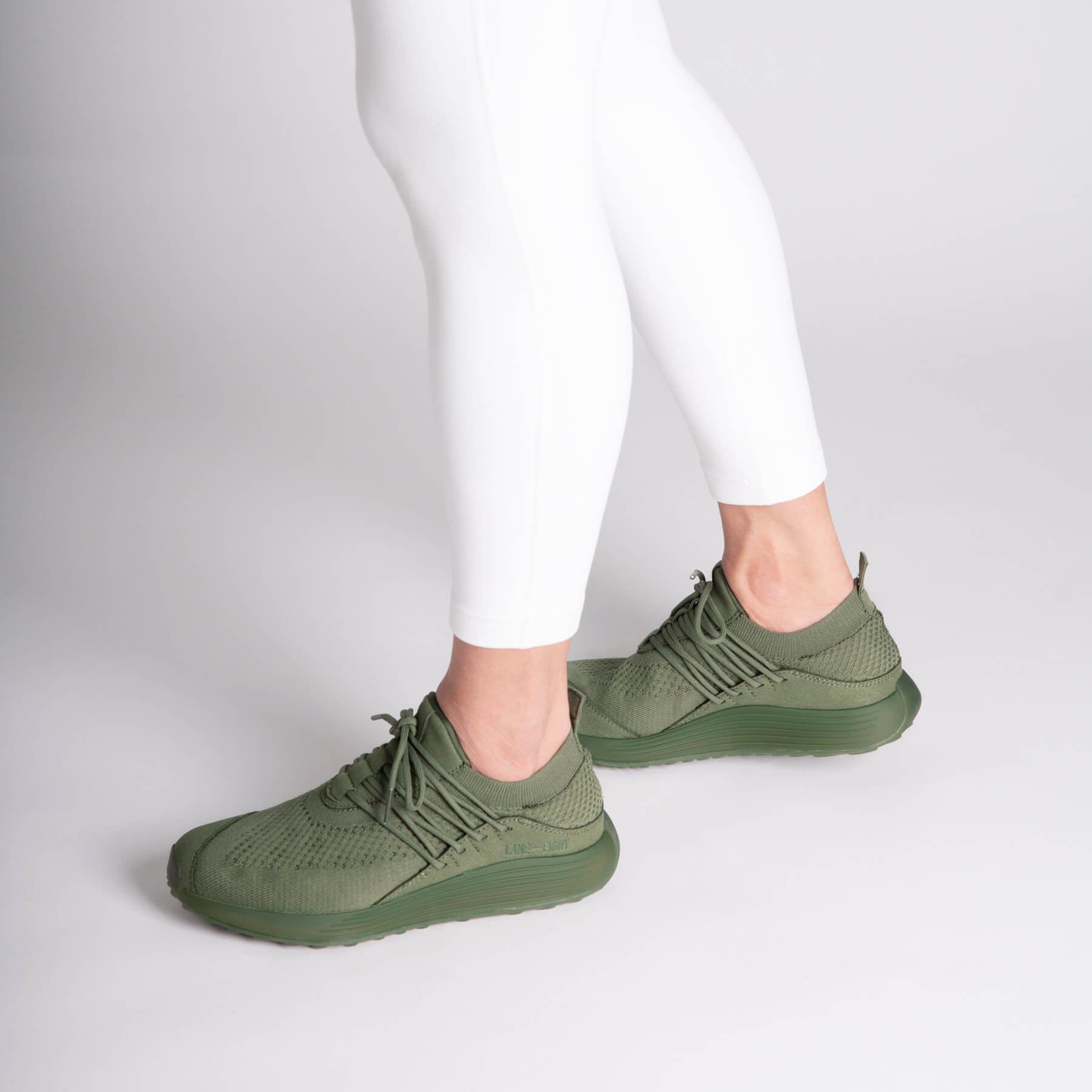 LANEEIGHT-TRAINER-AD-1-EarthGreen-WomensOnFoot