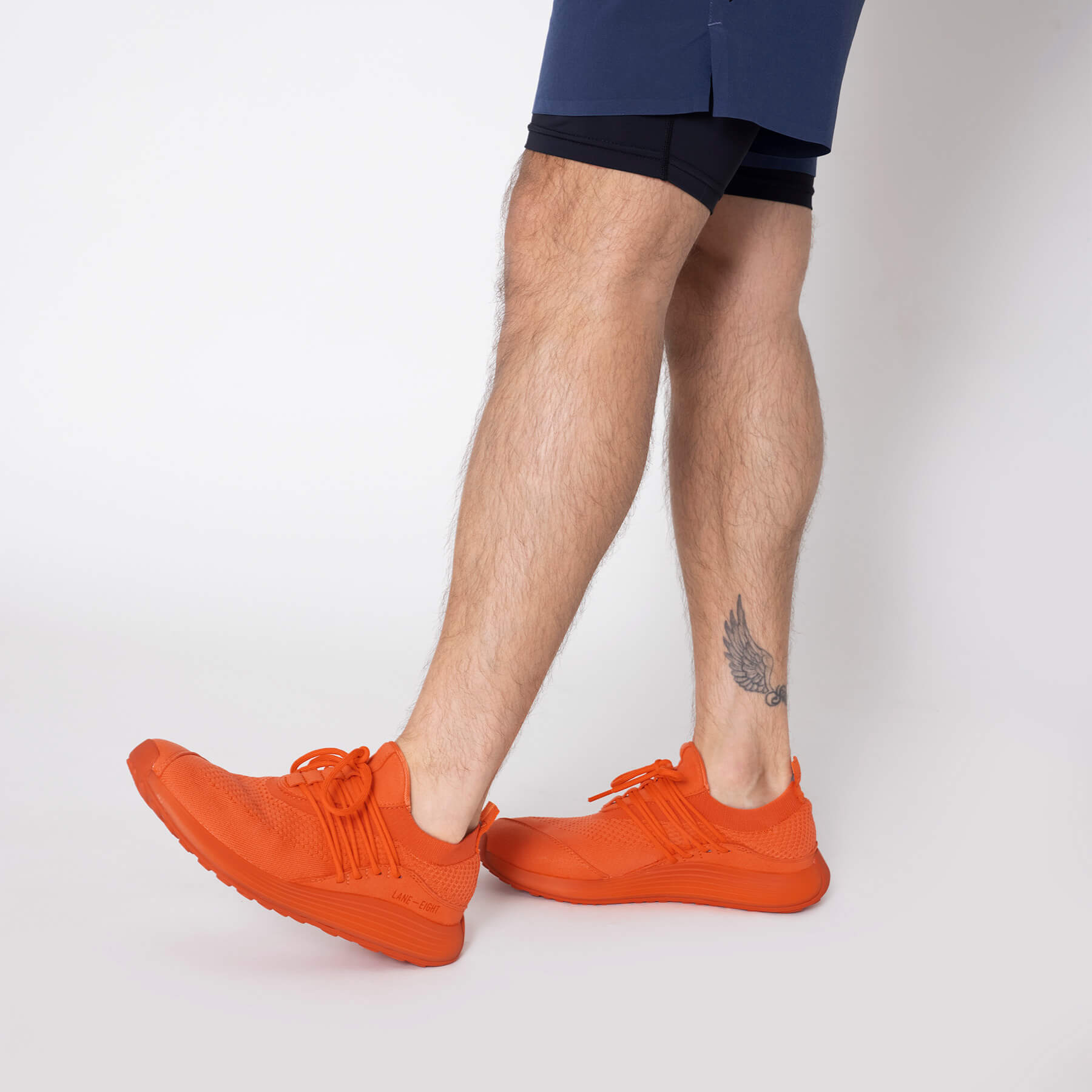 LANEEIGHT-TRAINER-AD-1-SunriseOrange-MensOnFoot