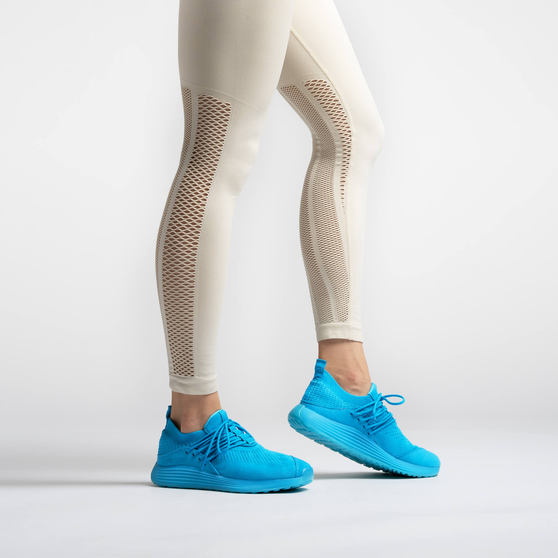 LANEEIGHT-TRAINER-AD-1-ElectricBlue-WomensOnFoot