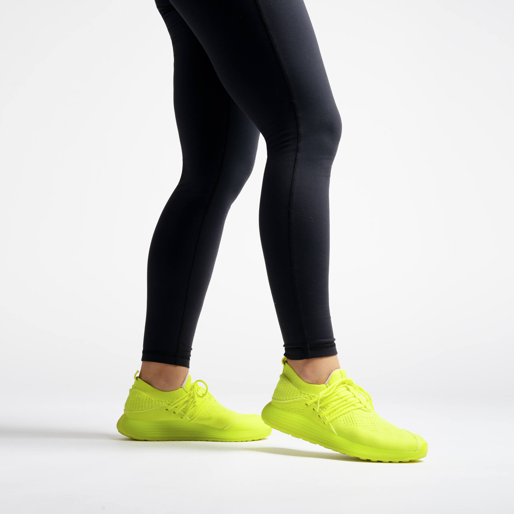 LANEEIGHT-TRAINER-AD-1-ElectricYellow-WomensOnFoot
